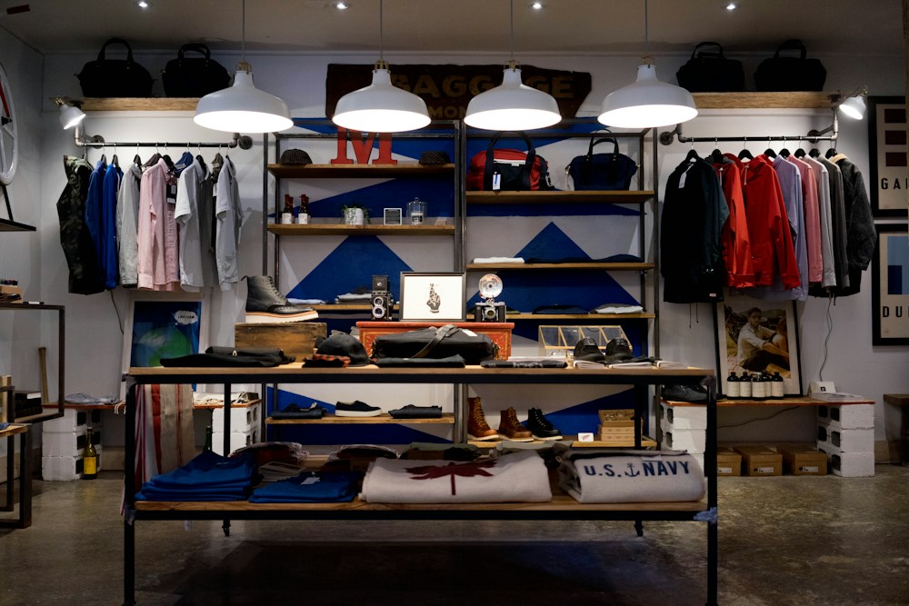 Independent retail shop with clothing displays and a welcoming storefront interior