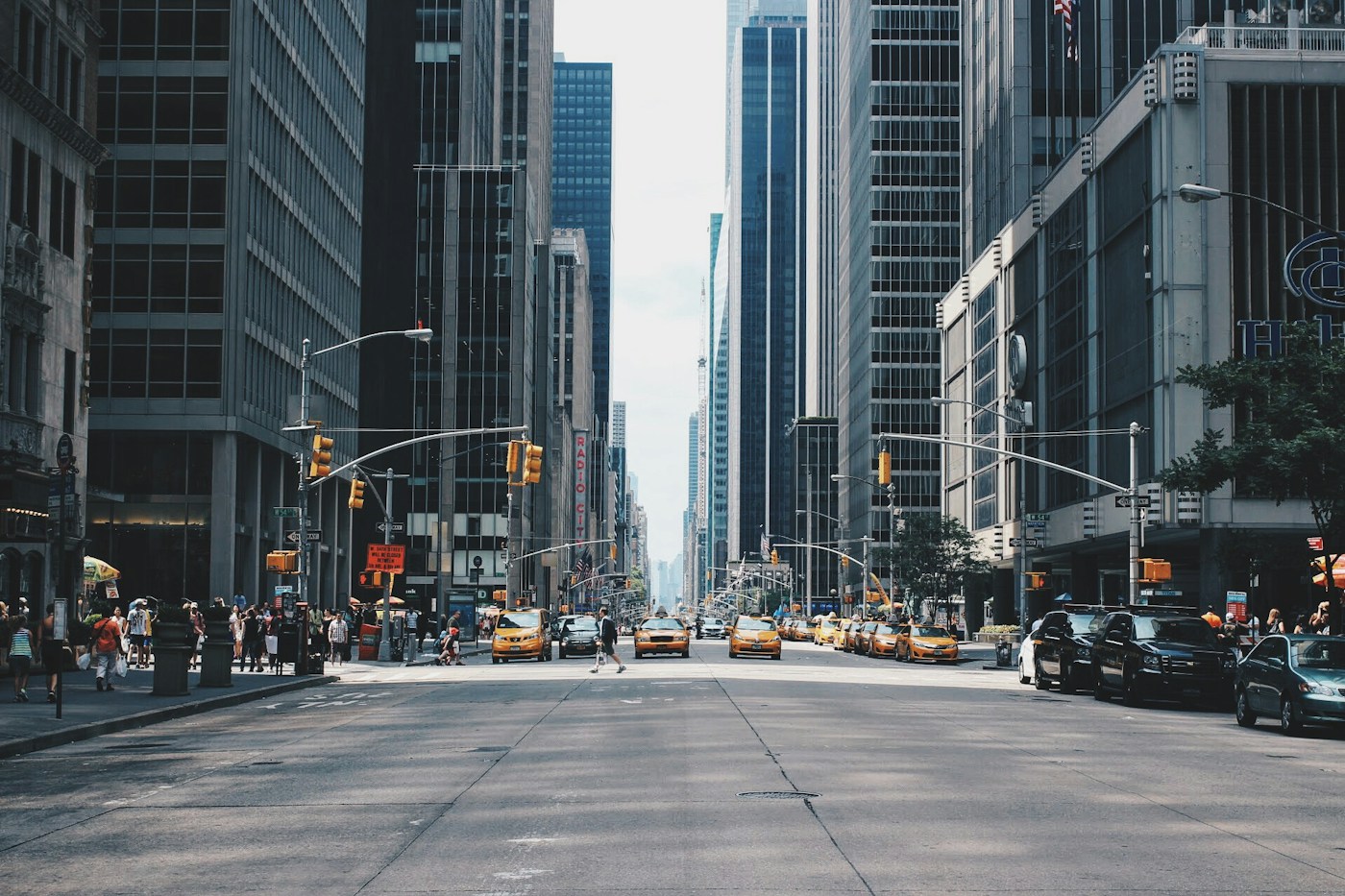 New York City commercial streetscape with office towers and street-level traffic